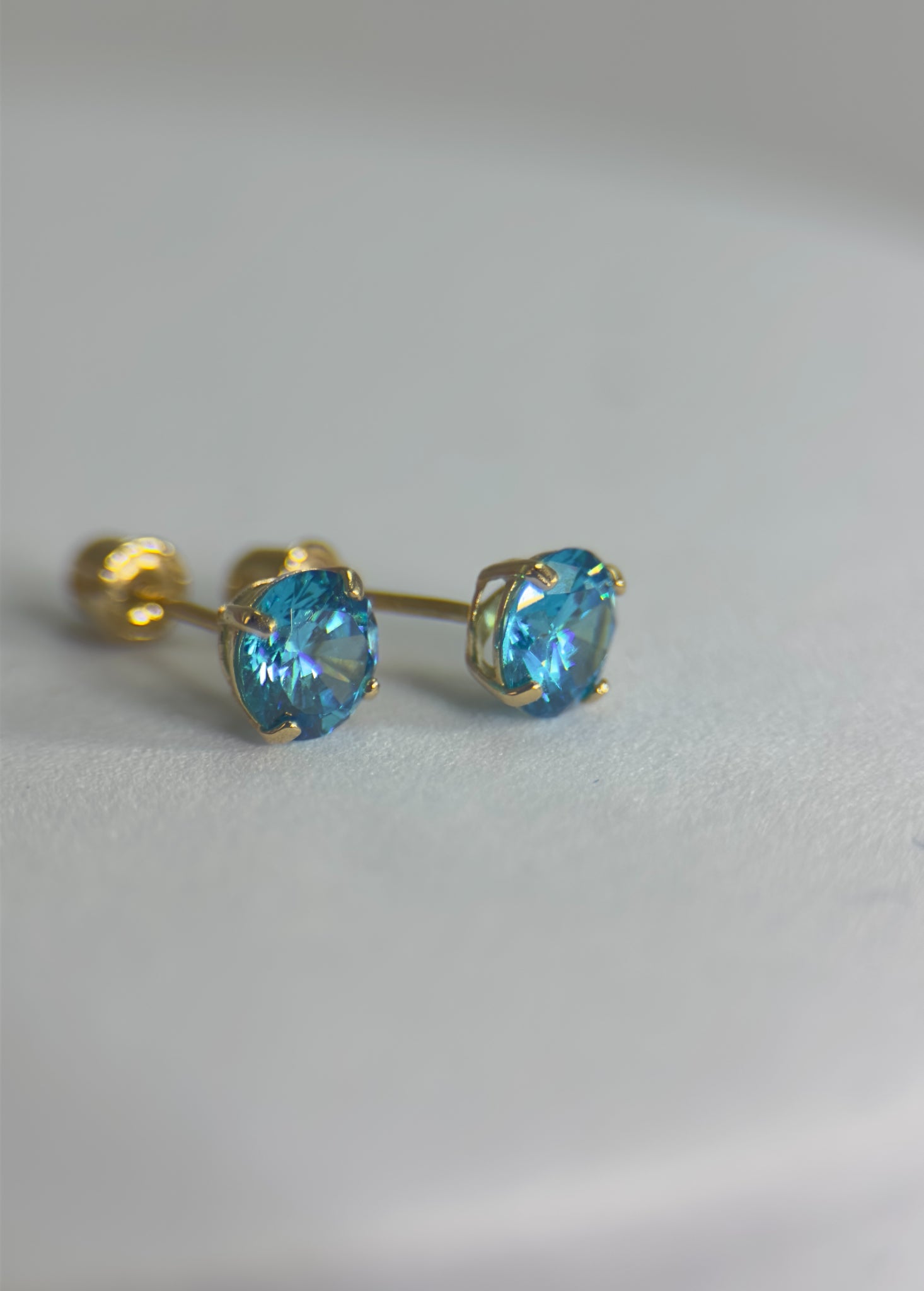 DR2390 - 14K Yellow Gold - Lab Created Blue Topaz - 14K Gold Studs